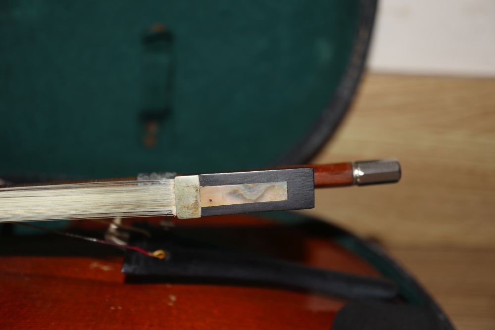 A 20th century Antonius Stradivarius Cremonensis violin, cased with two bows